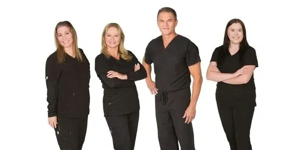 A group of people in black shirts and pants.