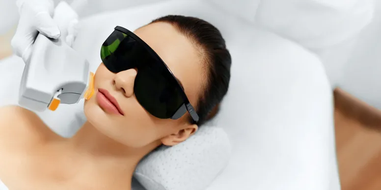 A woman with sunglasses on laying down