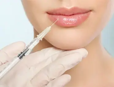 Women receiving beauty injection in lips