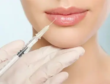 A woman getting her lips filled with botox.